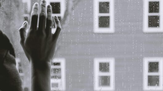 grayscale photo of woman right hand on glass